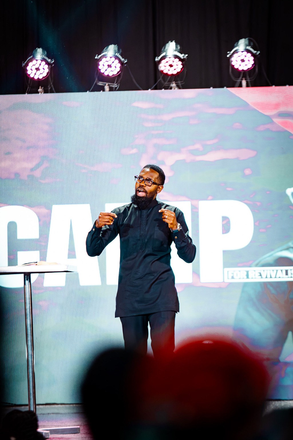 Rev. Benjamin Kasankya speaking